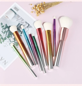 Detailed top view of 9-piece makeup brush set with colorful gradient metallic handles