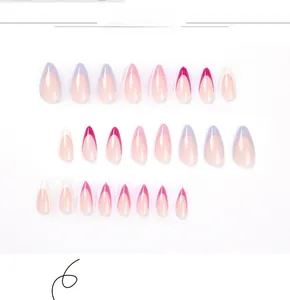 Detail view of almond press-on nails with purple and pink french gradient design