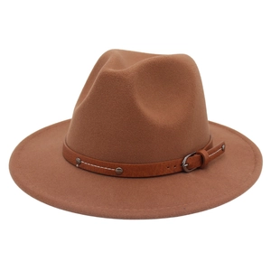 Detailed view of brown cashmere fedora hat with faux leather buckled belt and studs