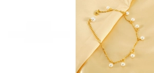 Detail of 18K gold plated anklet with pearls on satin, showing vacuum plating process