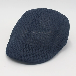 Detailed close-up of breathable navy blue mesh net fabric on the men's ivy flat cap