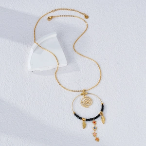 Bohemian gold chain necklace featuring black beads, golden feathers, and colorful charms
