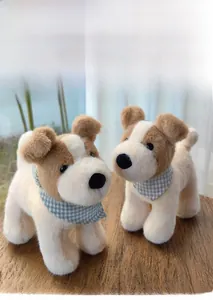 Close-up of stuffed Fox Terrier dogs with blue checkered scarves on wood surface