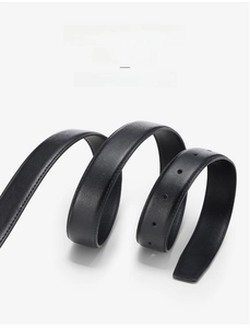 Macro shot of flexible black cowhide leather belt showing fine texture and neat stitching