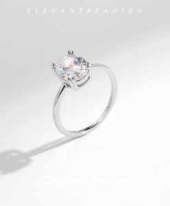 Macro shot of s925 silver ring with a four-prong set sparkling round cubic zirconia crystal