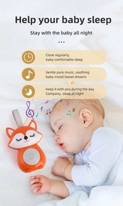 Detail view of fox baby sleep aid with timer, soothing music, and portable strap design
