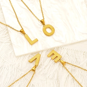 Fashionable gold titanium steel LOVE letter pendant necklace with textured finish