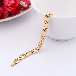 Detail shot of a minimalist gold-plated titanium steel germanium stone link bracelet
