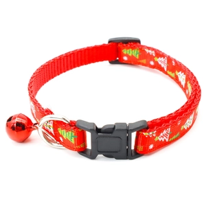 Detail of red Christmas tree nylon pet collar with plastic buckle and bell
