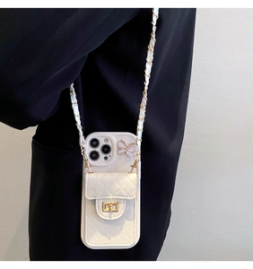 White quilted leather phone case with woven chain strap and butterfly card holder