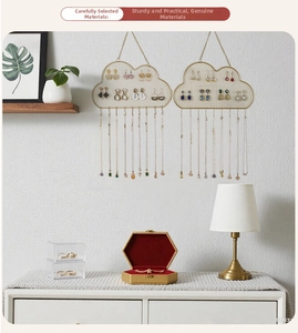 Cloud-shaped gold wire wall-mounted jewelry organizer with mesh panel and hooks