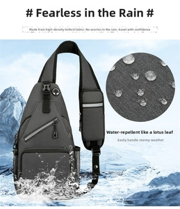 Close-up of waterproof dark grey oxford chest bag showing multi-pocket design and water resistance