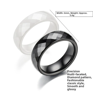 Detail view of 6mm faceted ceramic rings in black and white with 5.6g weight specs