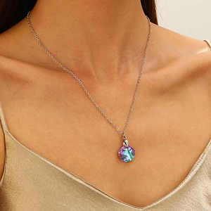 Blue ocean wave sun teardrop pendant necklace with iridescent crystal on female model