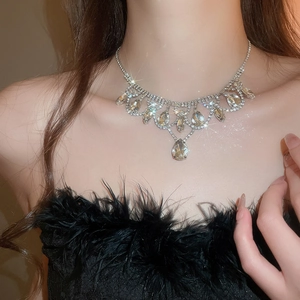 Luxurious water drop pendant necklace with diamonds on a model for an elegant look