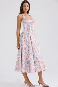 Detail of floral halter neck dress featuring corset-style waist and long flowing hemline