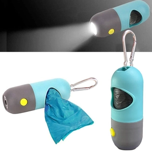 Capsule pet waste bag dispenser with LED flashlight and metal clip for dog walking