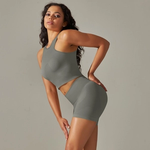 Detail view of seamless high-waist fitness shorts and racerback tank top in sage green