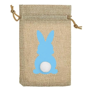 Detail of burlap Easter gift bag with blue bunny pattern and soft white pom-pom tail