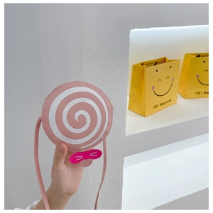 Pink lollipop round crossbody bag for kids featuring a cute cat whisker bow detail