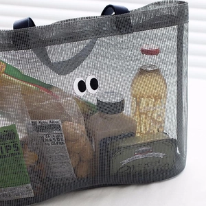 Grey mesh beach tote bag with cartoon eye design for travel and swimming storage