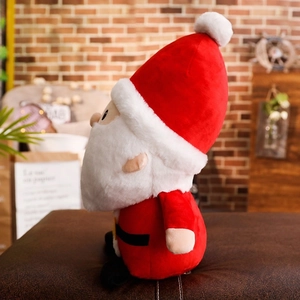 Side view of a soft plush Santa Claus doll featuring classic red suit and white beard
