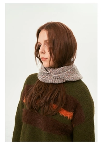 Close-up of a colorful wool-blend knit snood with textured striped faux fur sweater details