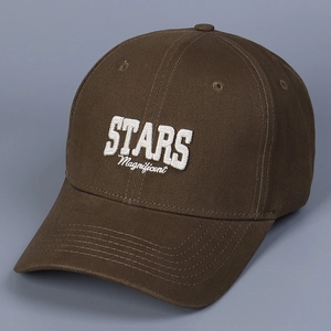 Side view of dark brown baseball cap featuring 3D white embroidery and classic curved brim
