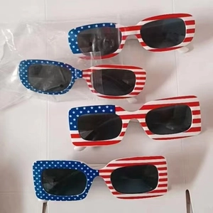 Stack of American flag sunglasses in bulk packaging for Independence Day parties