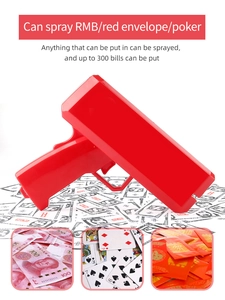 Detail view of red money gun spraying dollar bills, red envelopes, and playing cards