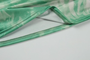 Close-up of marble pattern bikini fabric with durable double-stitch seam detail