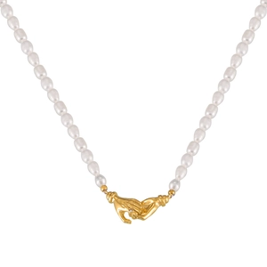 Lustrous pearl necklace featuring a gold handshake clasp and sparkling diamond accent