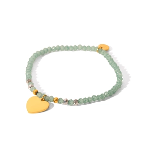 Bohemian beaded bracelet featuring green faceted stones and a gold heart pendant charm