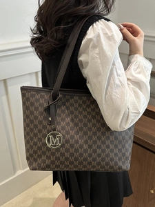 Large dark brown tote bag with M-pattern monogram and gold letter charm for women