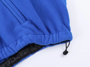 Detail of royal blue fleece hem with adjustable drawstring and black nylon lining