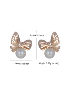 Detailed view of gold bow knot earrings with white pearls and dimensions labeling