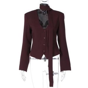 Close-up of burgundy women blazer vest with four-button closure and matching tie