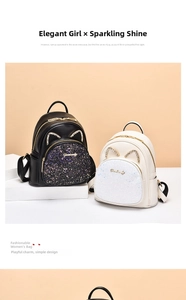 Close-up of black and cream white mini backpacks with sequins and cat ear rhinestone detail
