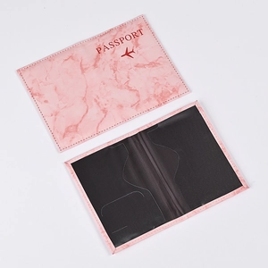 Pink marble PU leather passport holder featuring a dark red passport text and plane icon