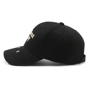 Side view of a black cotton baseball cap with 3D embroidery and reinforced curved brim
