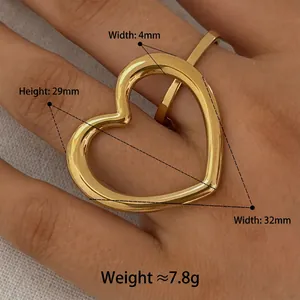 Golden oversized hollow heart ring in polished stainless steel with size dimensions