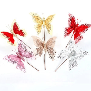 Detailed view of 3D velvet glitter butterfly ornaments in six assorted festive colors