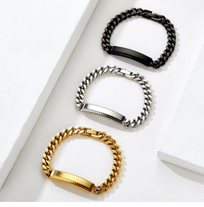 Detailed macro view of Cuban link ID bracelets in black, silver, and 18K gold finishes