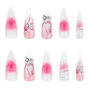 Extra long stiletto press-on nails with 3D metal bows and pink heart gradient design