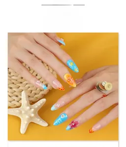 Close-up of tropical 3D floral almond nails with daisy and pearl details on summer background