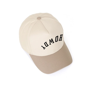 Close-up of HOWDY letter embroidery and khaki brim on two-tone baseball cap
