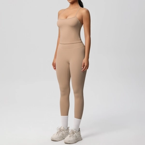 Detail view of light brown yoga set featuring spaghetti strap top and high waist leggings