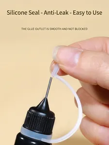 Detail of nail art glue bottle with precision metal tip and silicone sealing cap