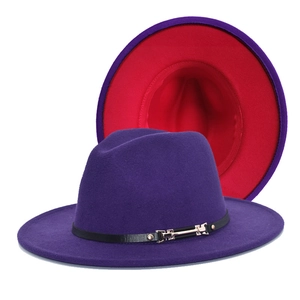 Detail of wool fedora with purple exterior, red interior, and black leather belt buckle