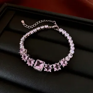 Luxury silver bracelet with pink zircon square pendant on black leather display